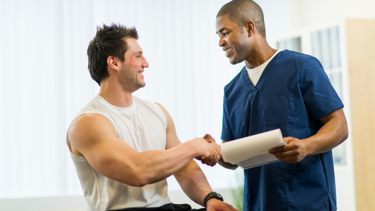physical therapist and patient shaking hands and forming a team