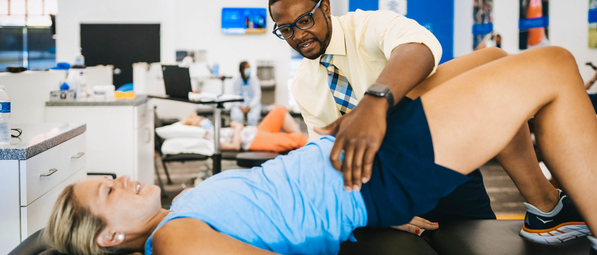 Physical therapist treating hip pain