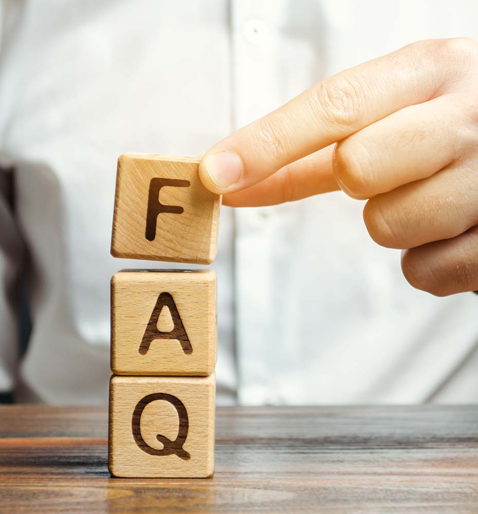 Businessman Puts Wooden Blocks With the Word FAQ (Frequently Asked Questions). Collection of Frequently Asked Questions on any Topic and Answers to Them. Instructions and Rules on Internet Sites